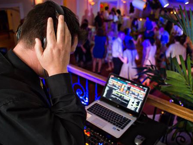 Professional DJ equipment setup with lighting