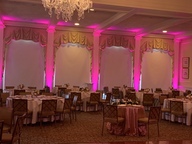 Backyard party with uplighting and festive atmosphere