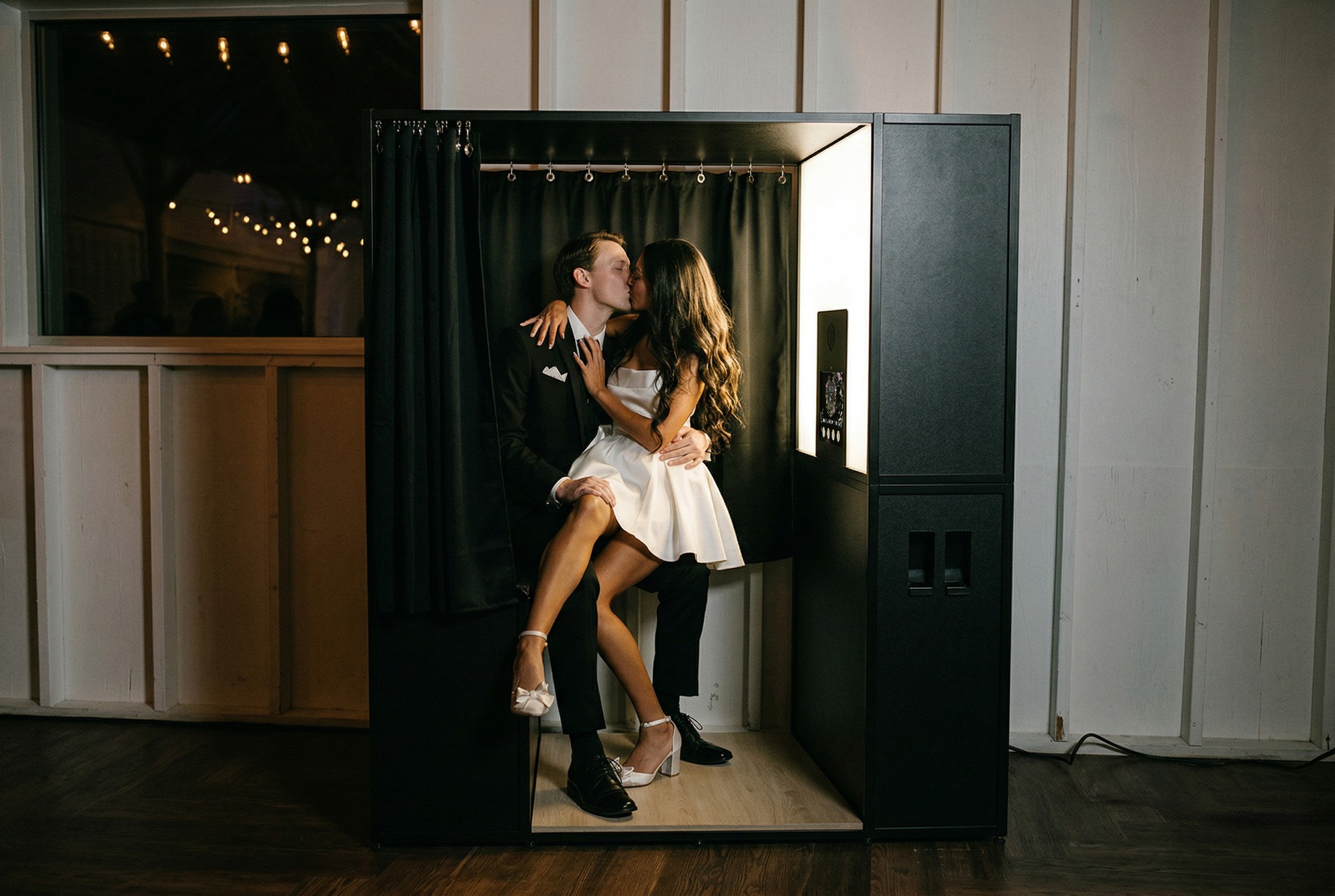 Enclosed photo booth wedding rental — private curtained booth for Jacksonville and St. Augustine weddings