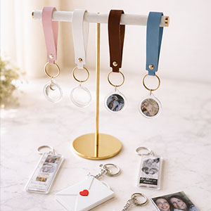 Photo booth keychain wedding favor — custom acrylic keepsake for Jacksonville and St. Augustine weddings