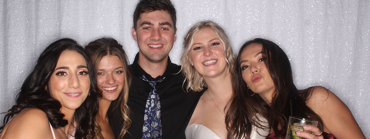 Wedding guests celebrating at a photo booth at a Jacksonville FL reception