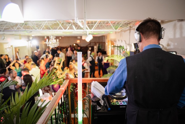 DJ playing music students love at school dance