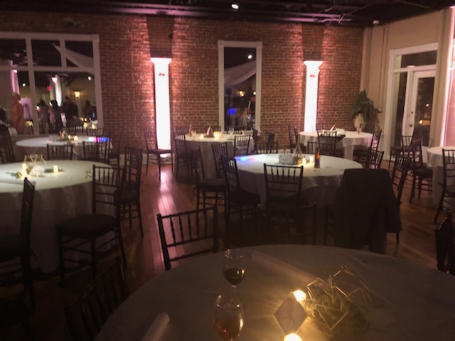 LED uplighting transforming a Jacksonville wedding venue with color