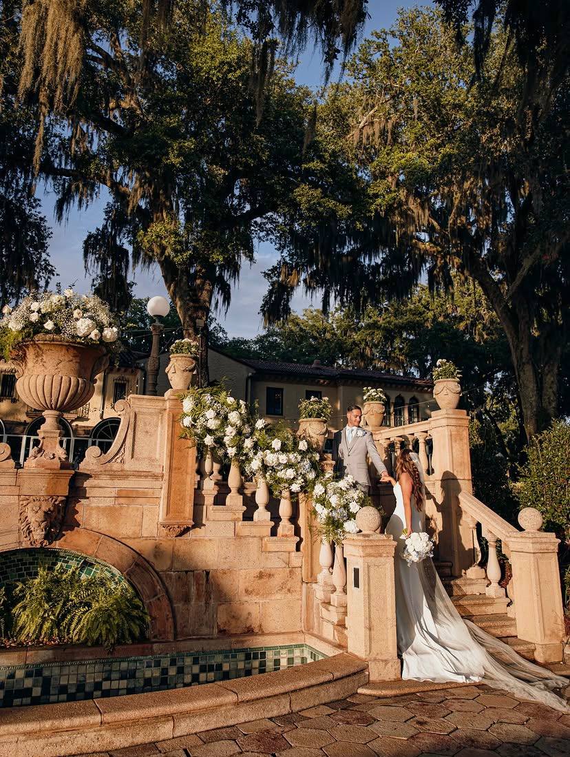 Bride and groom on the ornate stone staircase at Epping Forest Yacht Club Jacksonville FL — Footloose Entertainment wedding DJ