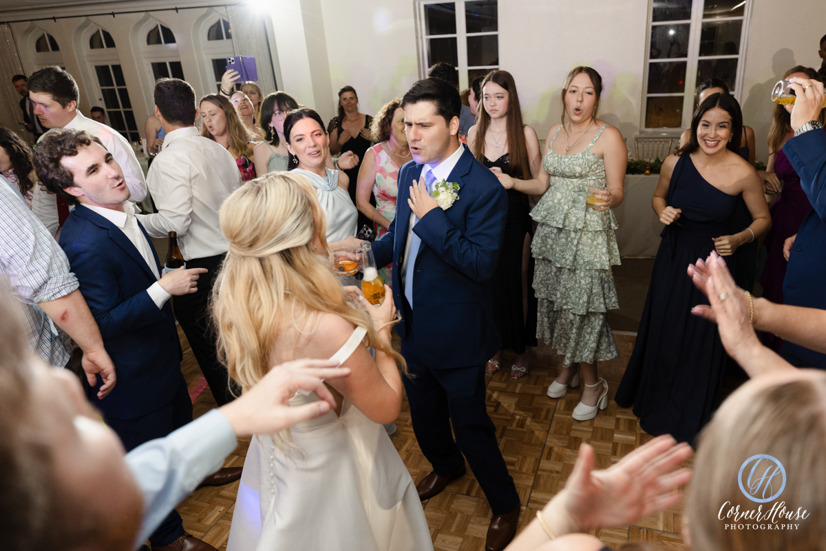 Bride and groom dancing with guests on the floor at Epping Forest Yacht Club Jacksonville FL — Footloose Entertainment wedding DJ