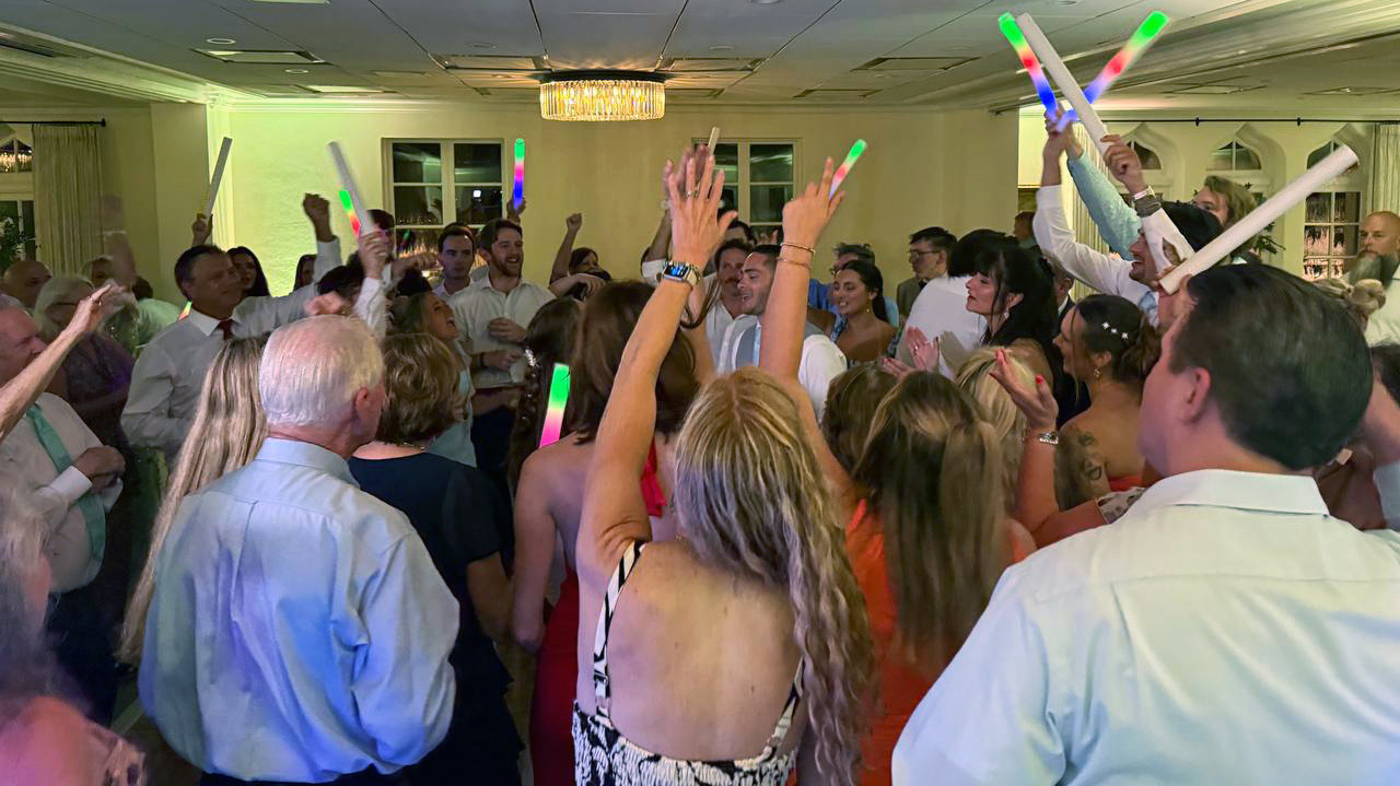 Wedding guests celebrating on the dance floor with uplighting at Epping Forest Yacht Club Jacksonville FL — Footloose Entertainment DJ