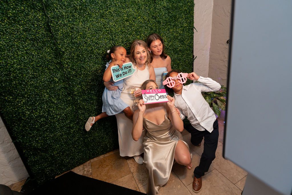 Guests using the Footloose Entertainment photo booth at Casa Marina Hotel wedding, Jacksonville Beach FL