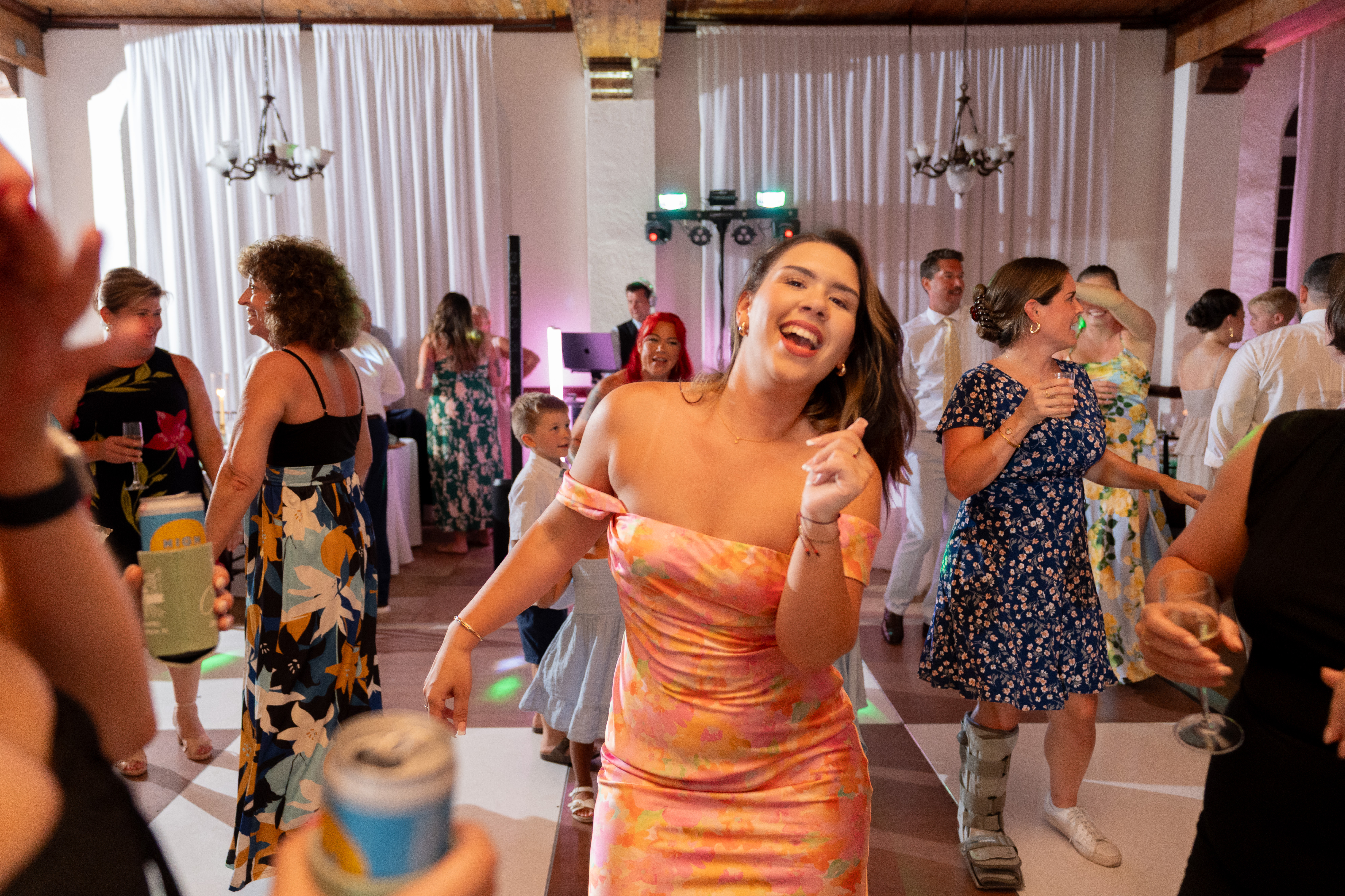 Guests dancing at a Casa Marina Hotel wedding reception with Footloose Entertainment DJ visible in the background, Jacksonville Beach FL