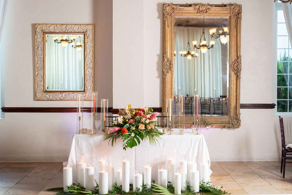 Sweetheart table with ornate gold mirrors at Casa Marina Hotel reception, Jacksonville Beach FL