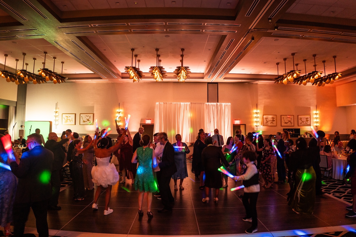Wedding reception at Embassy Suites St. Augustine FL, DJ lighting and dance floor energy during the celebration