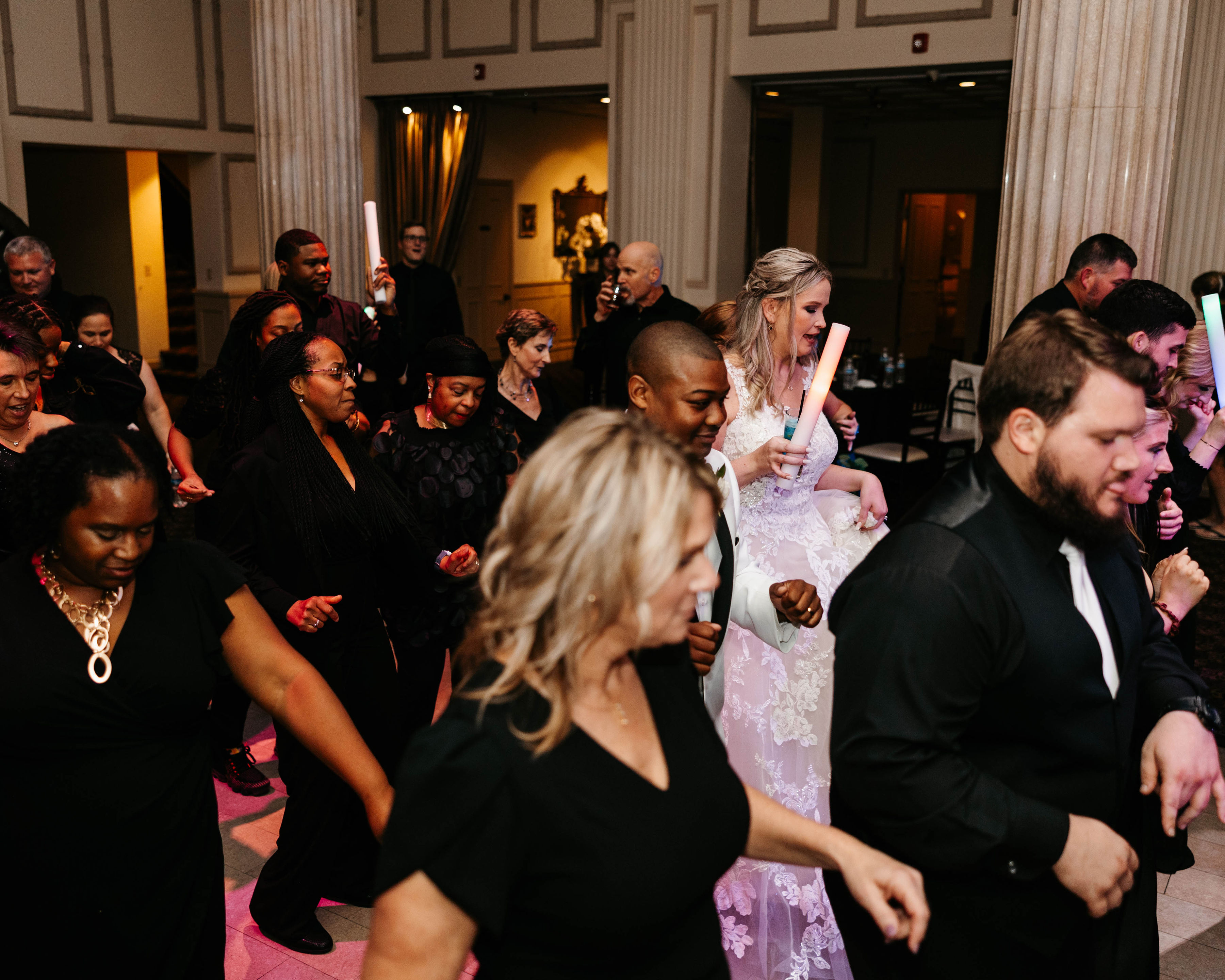 Wedding guests and bride celebrating on the dance floor at Treasury on the Plaza St Augustine FL — Footloose Entertainment wedding DJ
