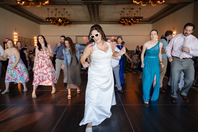 Wedding DJ reading the room at packed dance floor